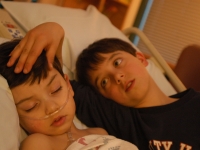 Samuel, comforted by his brother, Isaiah, was back in the hospital after pneumonia and other complications from a tonsilectomy at Dartmouth Hitchcock Medical Center in Lebanon, NH.  Dan Habib photo