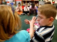 Nathaniel Orellana, a first-grader at the Haggerty School in Cambridge, Massachusetts, participates in an exercise during circle time. Nathaniel, who has a diagnosis of autism, is fully included at Haggerty.
