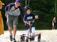 Dan Habib supports his son, Samuel Habib, during a t-ball game in Concord, NH, on May 27, 2006. Samuel uses a "Bronco" all-terrain walker to hit and get around the bases. From Habib's documentary film, Including Samuel, www.includingsamuel.com.  MANDATORY CREDIT: Lori Duff/Concord Monitor